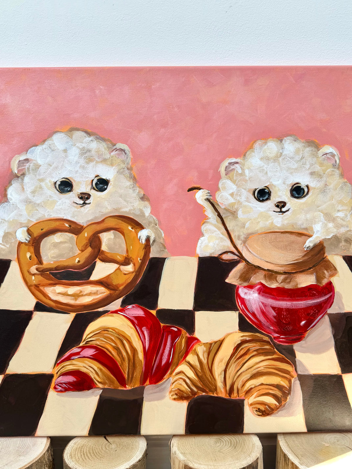 Bakery Buddies dog and pastry acrylic painting displayed in a styled interior setting