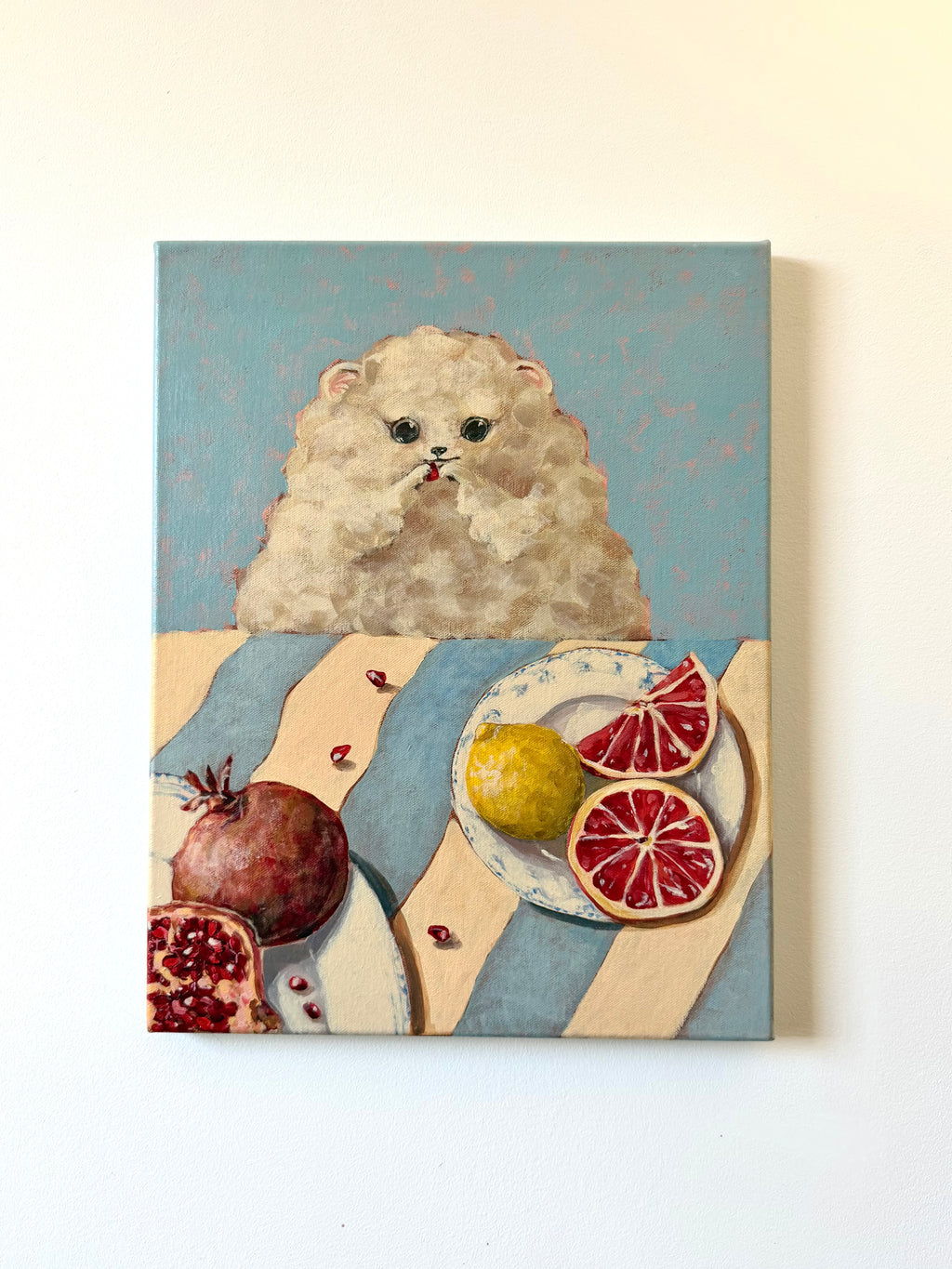 Little Picnic dog picnic acrylic painting displayed on a clean wall with colourful fruit details