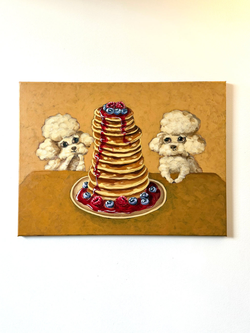Pancake Day whimsical dog and pancake artwork displayed on a clean white wall