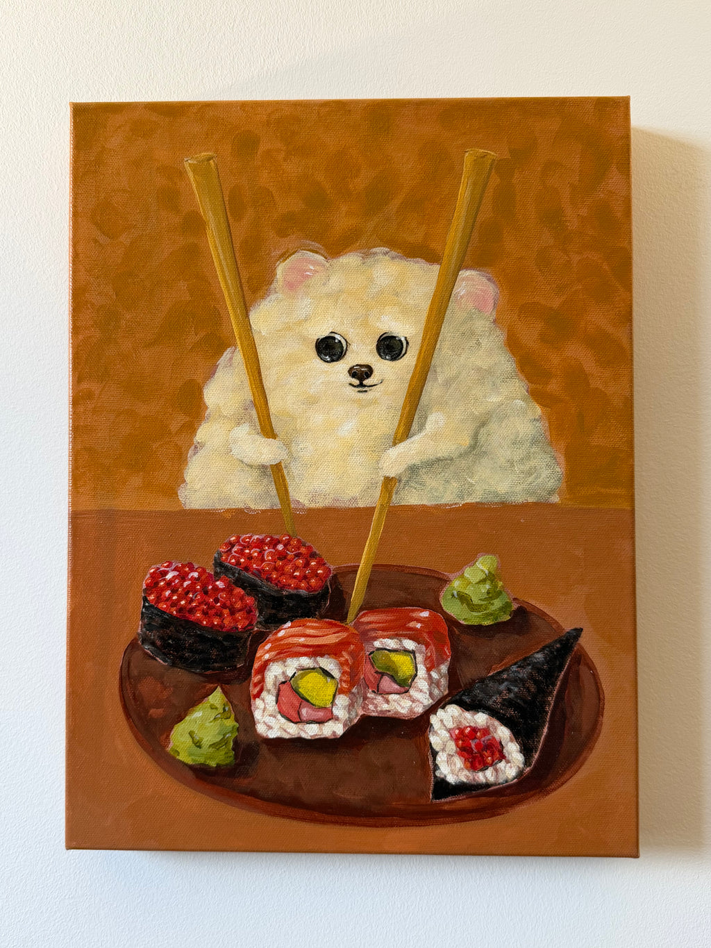 Sushi Lover whimsical dog and sushi artwork displayed on a clean white wall