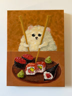 Sushi Lover whimsical dog and sushi artwork displayed on a clean white wall
