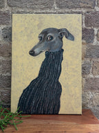 The Turtleneck greyhound acrylic painting shown from a side angle with textured gold background